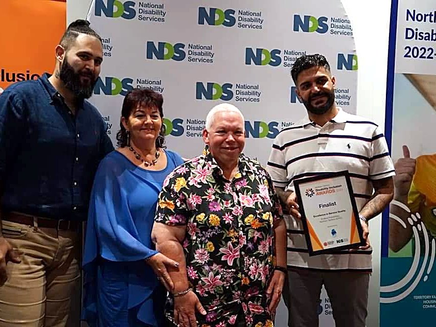 The EPNT team on awards night at the NT Disability Inclusion Awards, holding their framed certificate